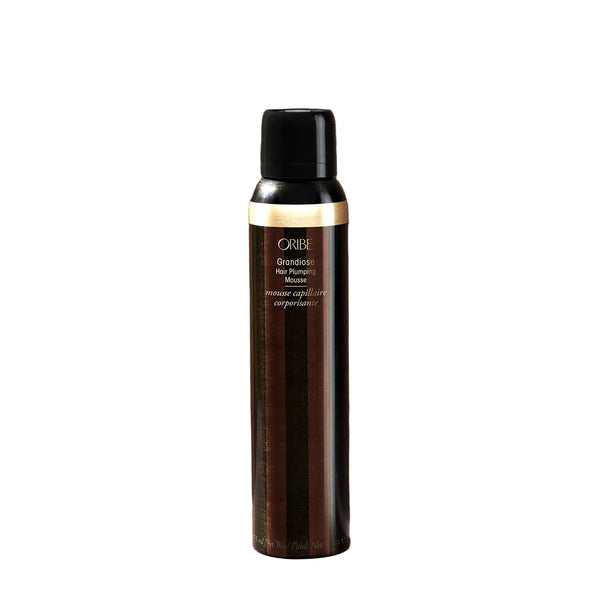 Hair product spray bottle with Oribe branding on a white background