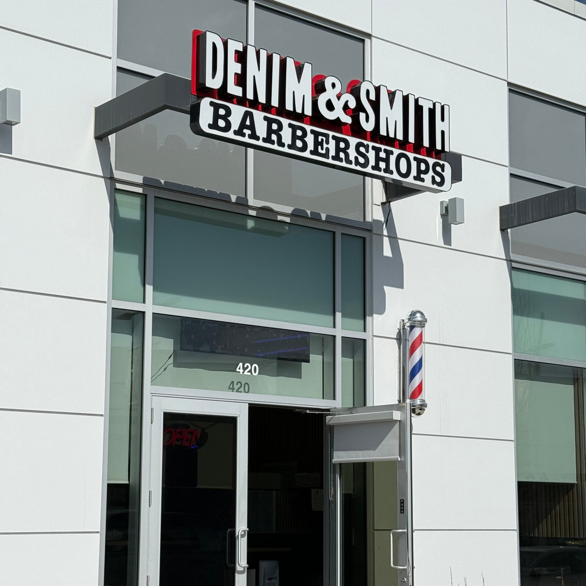 Denim & Smith Seton Calgary barbershop exterior after renovation in Southeast Calgary