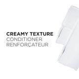 White towel with text 'Creamy Texture Conditioner Renforçateur' on a white background