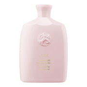 Oribe Serene Scalp Shampoo in a light pink bottle